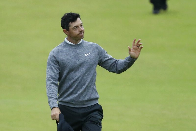 The Associated Press
FAVORITE FANNED:
Northern Ireland's Rory McIlroy waves to the crowd as he walks onto the 18th green Friday during the second round of the British Open at Royal Portrush in Northern Ireland.