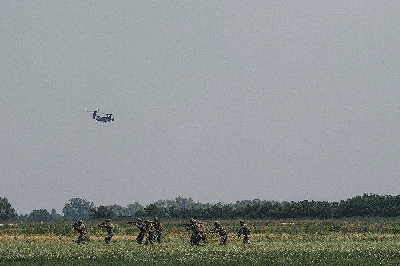 A U.S. V-22 Osprey flies overhead in June during maneuvers in Hungary involving Army Green Berets, Navy SEALs and NATO special forces troops as U.S. commandos team up with partners on Europe’s eastern flank to thwart Russia’s so-called hybrid warfare. 