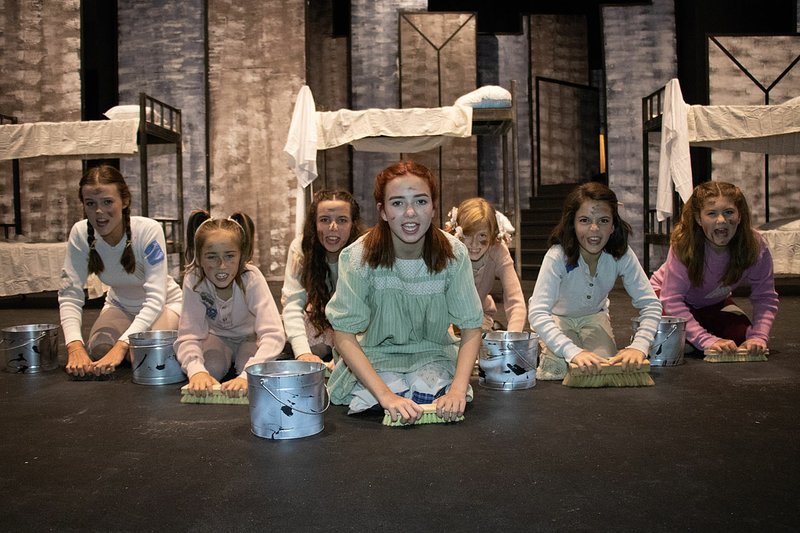 Photo by 4209 Creative It's "the hard-knock life" for the orphans of the Arkansas Public Theatre production of "Annie." Pictured from left are Stevie Grace St. John (Duffy), Greer Jennings (Molly), Astrid Allen (Kate), Graceanne Morgan (Annie), Caitlyn Murray (July), Elsa Meyer (Tessie) and Addi Jones (Pepper).