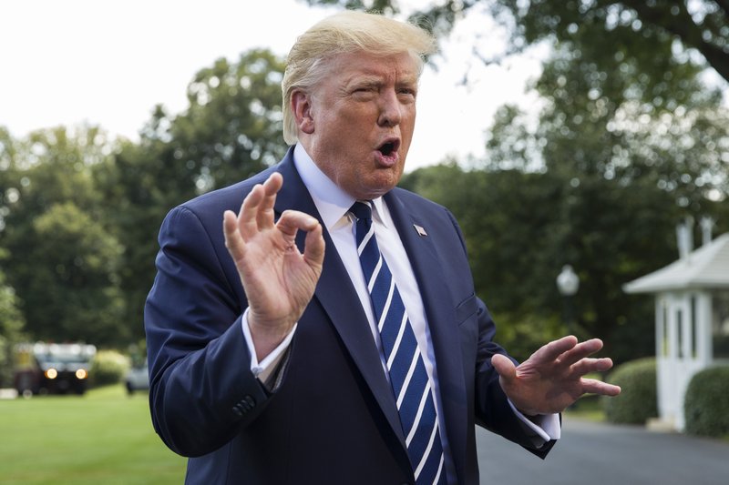 President Donald Trump speaks with reporters on the South Lawn of the White House before departing, Friday, July 19, 2019, in Washington. (AP Photo/Alex Brandon)