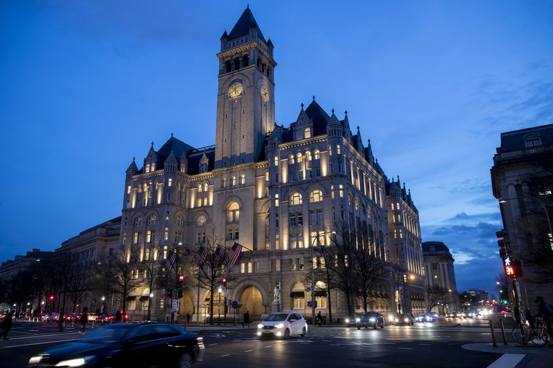 In this Jan. 23, 2019, file photo, the Trump International Hotel near sunset in Washington. An appeals court wants a judge to reconsider letting Justice Department lawyers immediately appeal a case accusing President Donald Trump of profiting off the presidency. (AP Photo/Alex Brandon, file)