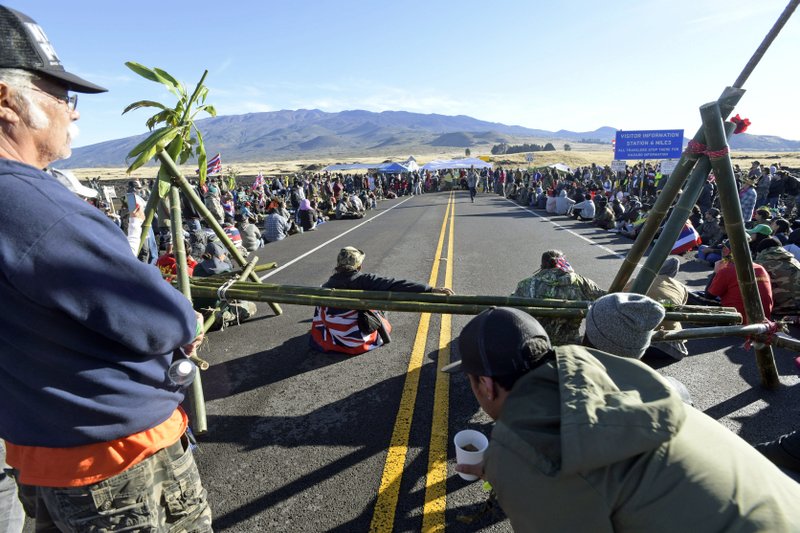 Protesters continue their opposition vigil against the construction of the Thirty Meter Telescope at Mauna Kea on the Big Island of Hawaii Friday, July 19, 2019.  (Bruce Asato/Honolulu Star-Advertiser via AP)