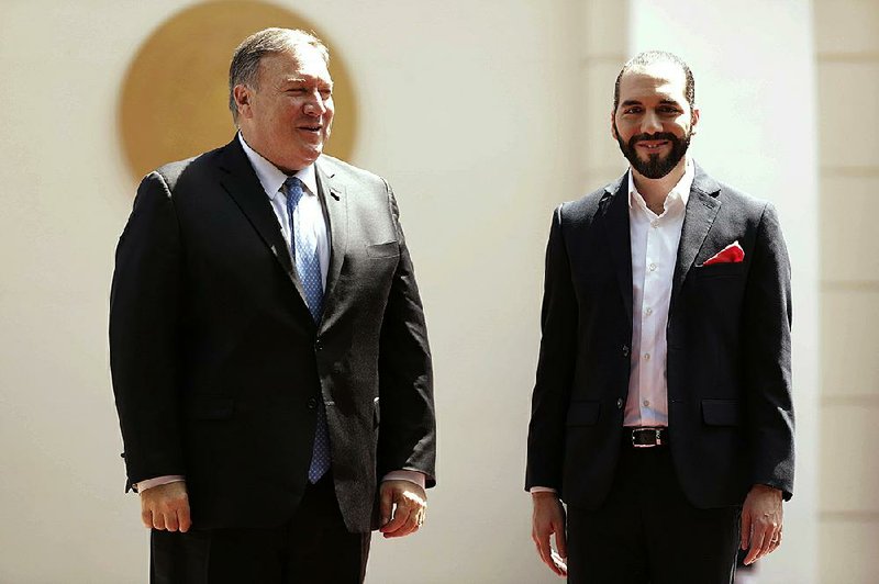 U.S. Secretary of State Mike Pompeo (left) meets Sunday with El Salvador’s President Nayib Bukele during a stop at the Presidential House in San Salvador, El Salvador, after earlier meeting with Mexican Foreign Secretary Marcelo Ebrard. 