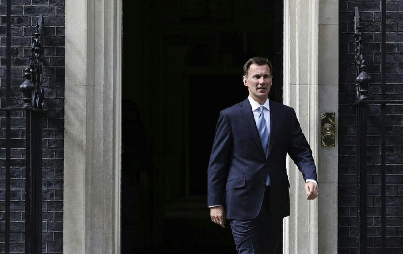 British Foreign Minister Jeremy Hunt leaves No. 10 Downing St. in London on Saturday after an emergency session on Iran. 