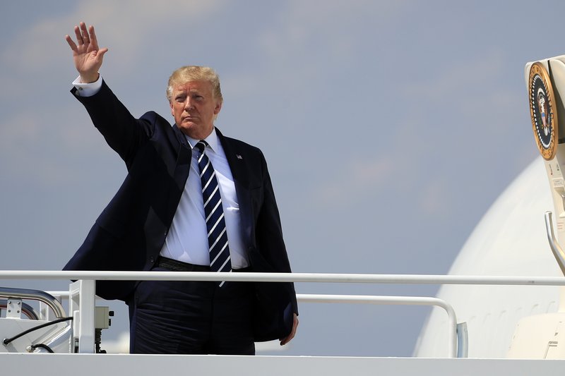 President Donald Trump waves as he boards Air Force One at Andrews Air Force Base, Md., Friday, July 19, 2019. (AP Photo/Manuel Balce Ceneta)