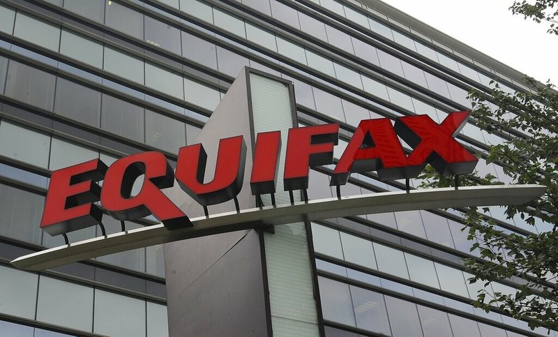 FILE - This July 21, 2012, file photo shows signage at the corporate headquarters of Equifax Inc., in Atlanta. Equifax will pay up to $700 million to settle with the Federal Trade Commission and others over a 2017 data breach that exposed Social Security numbers and other private information of nearly 150 million people. The proposed settlement with the Consumer Financial Protection Bureau, if approved by the federal district court Northern District of Georgia, will provide up to $425 million in monetary relief to consumers, a $100 million civil money penalty, and other relief. (AP Photo/Mike Stewart, File)