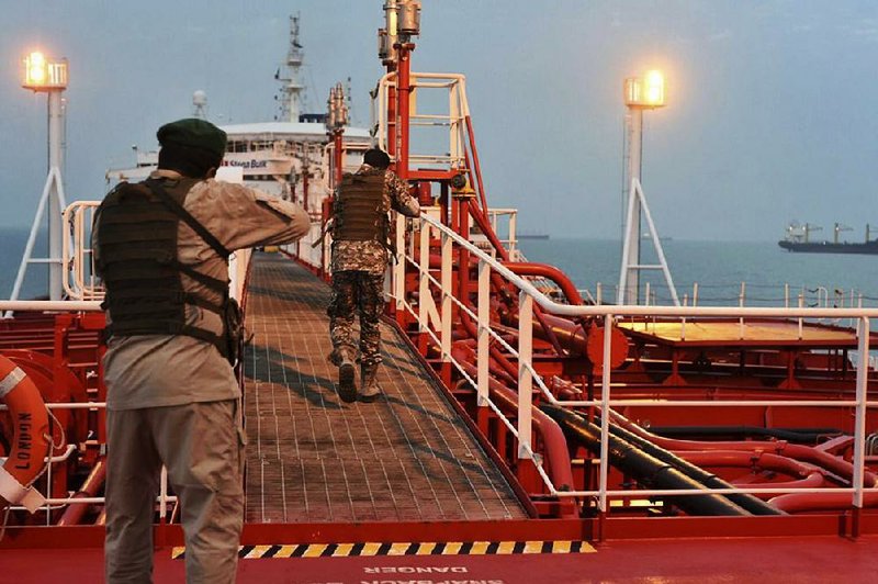 A Revolutionary Guard speedboat circles the oil tanker Stena Impero in the Iranian port of Bandar Abbas in this photo released Monday. Iran seized the British-flagged vessel last week. 