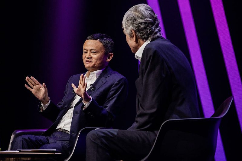 Jack Ma (left), chairman of Alibaba Group Holding Ltd., speaks with Maurice Levy, chairman of Publicis Groupe SA, in Paris earlier this year. The Chinese e-commerce giant has opened Alibaba.com to let U.S. firms sell to buyers around the world. 