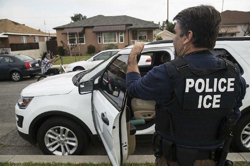 A federal Immigration and Customs Enforcement agent arrives at a neighborhood in Montebello, Calif., in April 2017. A widely publicized operation last week targeting more than 2,000 migrants netted just 35 people, figures show.