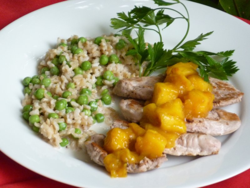 Pork Scaloppini With Rum-Mango Sauce and Coconut Rice Photo by Linda Gassenheimer (TNS)