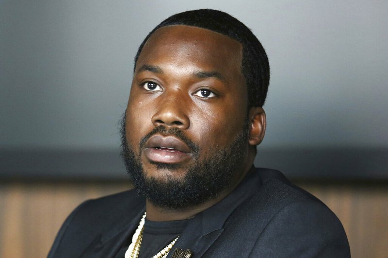 In this Tuesday, July 23, 2019 photo, Meek Mill makes an announcement of the launch of Dream Chasers record label in joint venture with Roc Nation, at the Roc Nation headquarters in New York. A Pennsylvania appeals court has thrown out rapper Meek Mill's decade-old conviction in a drug and gun case. The unanimous three-judge opinion Wednesday grants the rapper born Robert Williams a new trial because of new evidence of alleged police corruption. (Photo by Greg Allen/Invision/AP)