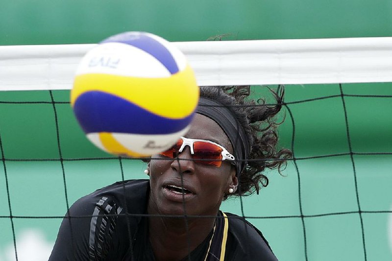 Mannika Charles of the Virgin Islands prepares to make a return during a women’s beach volleyball preliminary match  against Brazil on Wednesday at the Pan Am Games in Lima, Peru. 
