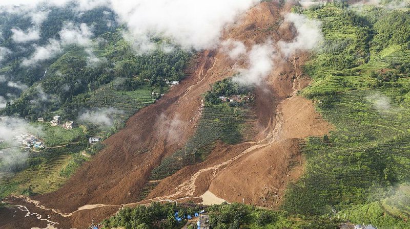 Pingdi Village in southwestern China’s Guizhou Province sits devastated by a landslide Wednesday. 