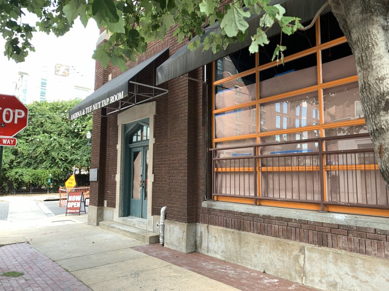 Brown paper covers the windows of the former Andina Cafe, East Third Street and River Market Avenue. Arkansas Democrat-Gazette/Eric E. Harrison