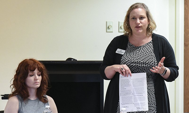 The Sentinel-Record/Grace Brown ADVOCATES: Ginny Zimmermann, education policy director for Arkansas Advocates for Children and Families, right, and AACF Outreach Director Rebecca Zimmermann discuss where Arkansas stands in health, education, economic well-being and family and community well-being during a Ouachita Area Youth Council meeting at Ouachita Behavioral Health and Wellness on Tuesday.