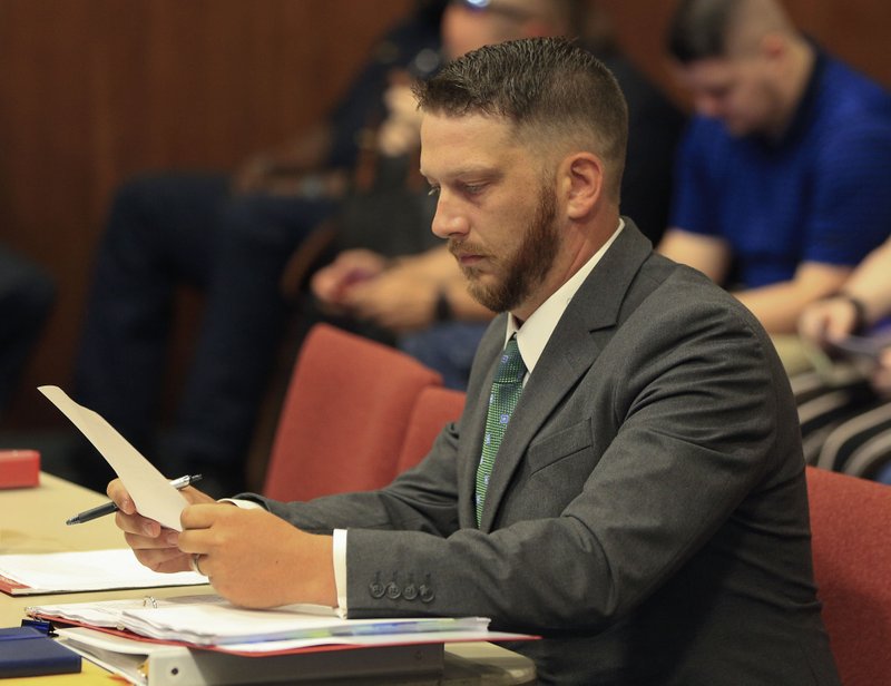 FILE — Former Little Rock Police officer Charles Starks waits for the beginning of his appeal hearing before the Little Rock Civil Service Commission.