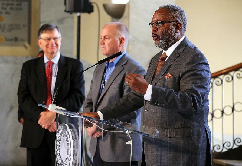 Tom Carpenter (left),  Little Rock city attorney,  is shown with Little Rock Police chief Keith Humphrey (right) and former interim chief Wayne Bewley (center) in this March 21, 2019, photo at Little Rock City Hall. 
