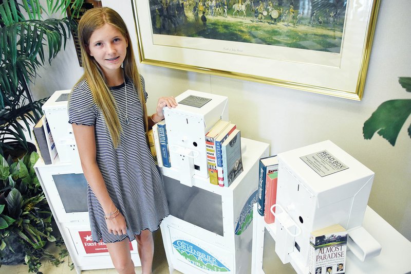 Madelyn Larrimore, 13, of Greenbrier stands with a Read Box, which will offer free books for people to read. She came up with the idea as part of her EAST (Environmental and Spatial Technology) class at Greenbrier Middle School. Three boxes will be placed in Greenbrier.