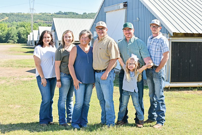 The Rusty Davis family of Russellville is the 2019 Pope County Farm Family of the Year. Family members include, from left, Bailey Davis-Watson, Breanna Davis, Rebecca Davis, Rusty Davis, Randall Watson with 4-year-old Ellie Watson, and Cole Davis. The family raise hay, cattle and broilers.