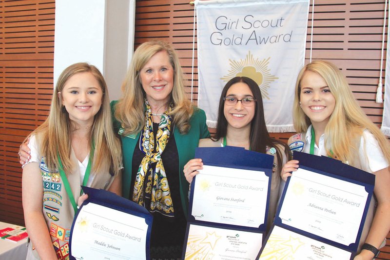 Maddie Johnson, from left, Dawn Prasifka, Giovana Stanford and Adrianna Perlsen pose for a photo after Johnson, Stanford and Perisen received their Girl Scout Gold Awards. Prasifka, the chief executive officer for Girl Scouts-Diamonds of Arkansas, Oklahoma and Texas, was present for the ceremony.