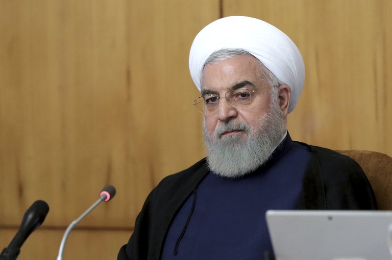 In this photo released by the office of the Iranian Presidency, President Hassan Rouhani speaks in a cabinet meeting in Tehran, Iran, Wednesday, July 24, 2019. President Hassan Rouhani suggested on Wednesday that Iran might release a U.K.-flagged ship if Britain takes similar steps to release an Iranian oil tanker seized by the British Royal Navy off Gibraltar earlier this month. (Iranian Presidency Office via AP)