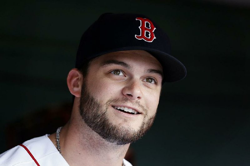 Boston Red Sox's Andrew Benintendi stands in the dugout before a baseball game against the Toronto Blue Jays in Boston, Monday, July 15, 2019. 
