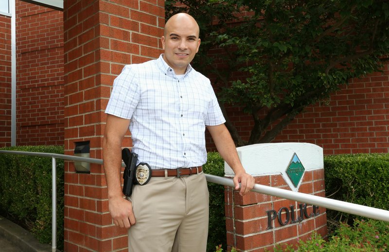 NWA Democrat-Gazette/DAVID GOTTSCHALK Detective David Guerrero with Springdale's Police Department poses July 16 at the police station. Police officials in Northwest Arkansas say they have made a concerted effort in recent years to recruit minority officers to better reflect the communities they serve.