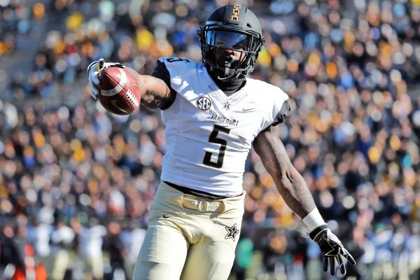 In this Nov. 10, 2018, file photo, Vanderbilt running back Ke'Shawn Vaughn celebrates as he runs into the end zone after catching a pass for a touchdown during the first half of an NCAA college football game against Missouri, in Columbia, Mo. Vaughn was named newcomer of the year on The Associated Press All-Southeastern Conference team, announced Monday, Dec. 3, 2018. (AP Photo/Jeff Roberson, File)