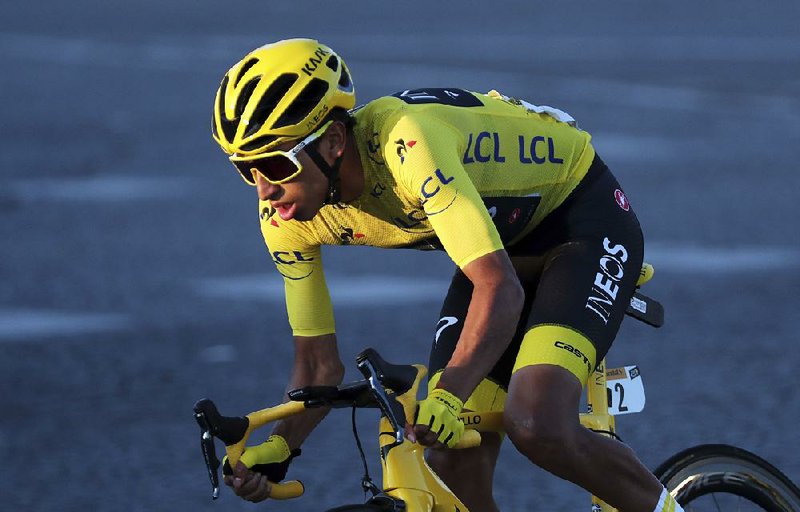 Colombia’s Egan Bernal, wearing the overall leader’s yellow jersey, rides on the Champs-Elysees during the final stage of the Tour de France on Sunday in Paris.