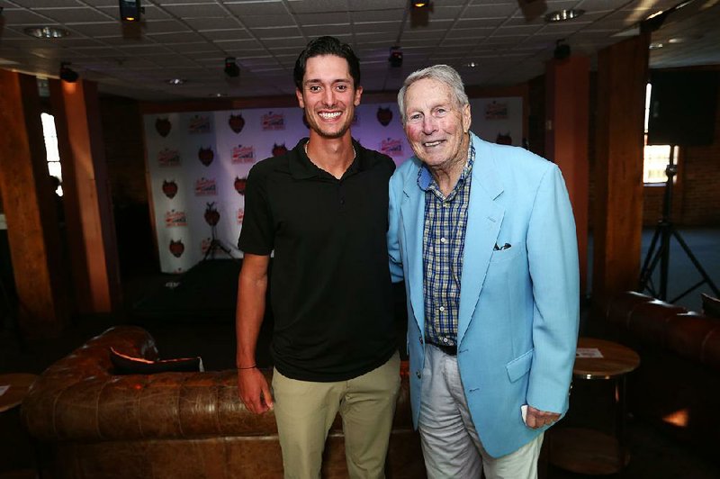 Former Arkansas pitcher Blaine Knight (left), a Baltimore Orioles prospect, met Hall of Famer and Little Rock native Brooks Robinson at a fundraiser Thursday at Camden Yards in Baltimore.