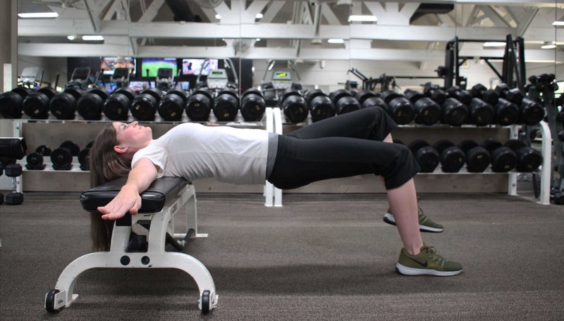 Amy Williams, assistant manager of Little Rock Racquet Club, demonstrates the Single Leg Hip Thrust. (Arkansas Democrat-Gazette/CELIA STOREY)