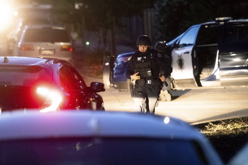 Police work a scene after a deadly shooting at the Gilroy Garlic Festival in Gilroy, Calif., Sunday, July 28, 2019. (AP Photo/Noah Berger)

