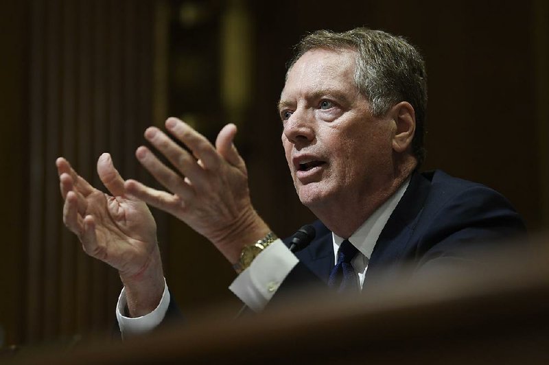 U.S. Trade Representative Robert Lighthizer, shown testifying in June before the Senate Finance Committee, has met four times recently with House Democrats to discuss their concerns about the rewrite of a trade pact with Canada and Mexico, which requires congressional approval. 