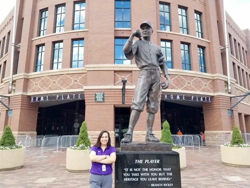 Photo submitted Abi Sislo, 2014 graduate of Siloam Springs High School, is a data engineer in baseball and development research for the Colorado Rockies. Sislo is seen here in front of Coors Field in Denver, the home of the Rockies.