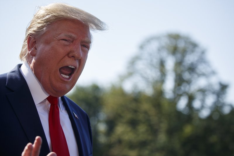 President Donald Trump talks with reporters before departing for an event to celebrate the 400th anniversary celebration of the first representative assembly at Jamestown, on the South Lawn of the White House, Tuesday, July 30, 2019, in Washington. (AP Photo/Evan Vucci)


