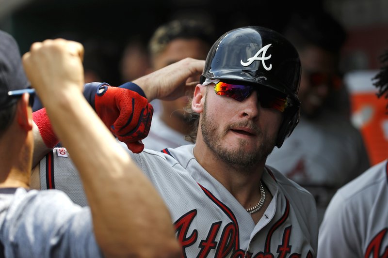 Atlanta Braves' Gordon Beckham throws out a St. Louis Cardinals