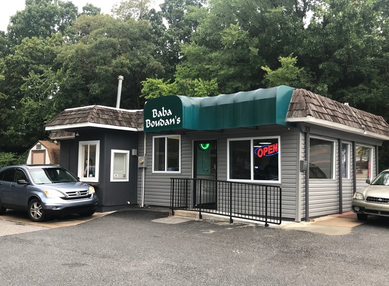 NWA Democrat-Gazette/DAVID GOTTSCHALK Baba Boudan's in Fayetteville reopened Thursday morning for the first time since an accident that left a vehicle inside the shop.