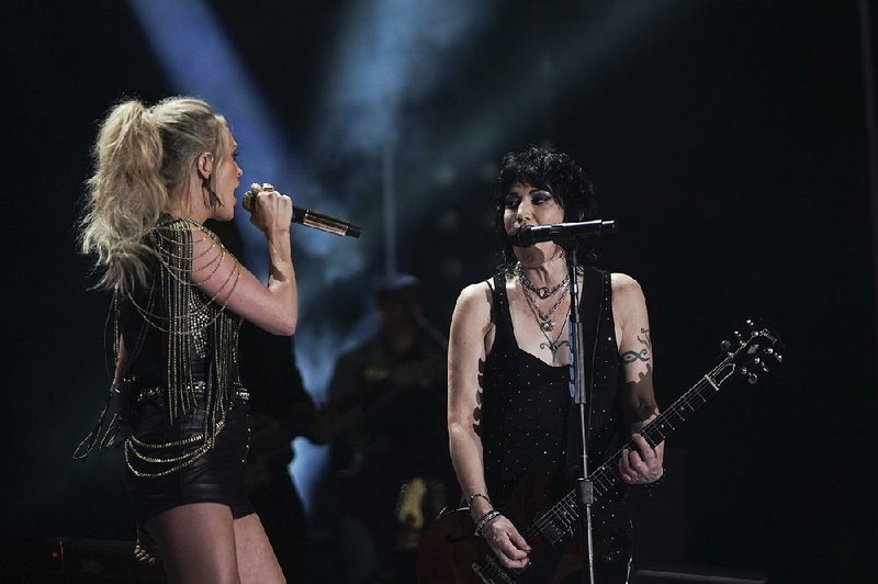 Carrie Underwood and Joan Jett perform together during ABC’s CMA Fest.