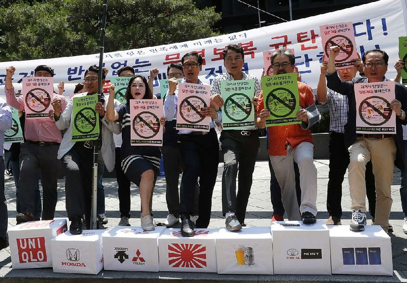 South Korean business owners rally last month in front of the Japanese Embassy  in Seoul, South Korea, calling for a boycott of Japanese products to protest Tokyo’s tightening control on exports of materials needed in South Korea’s technology industry.