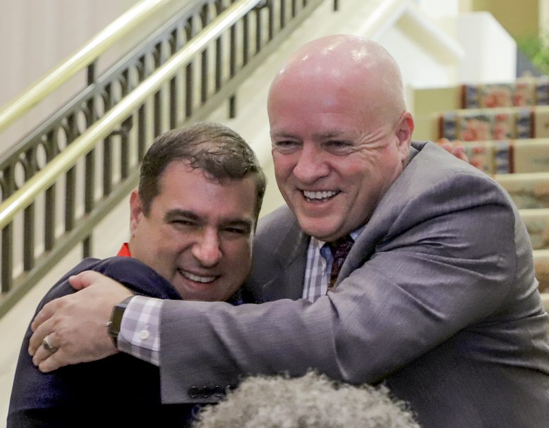 Arkansas Democrat-Gazette/JOHN SYKES JR. - Little Rock School Superintendent Mike Poore, right, hugs Jeffrey Whitlow, a teacher at Don Roberts Elementary School in Little Rock. Whitlow is one of four semi-finalists for 2020 Arkansas Teacher of the Year.