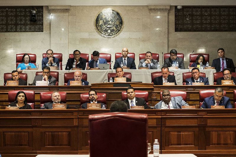 Pedro Pierluisi (back to camera) speaks to Puerto Rico’s House of Representatives in San Juan on Friday during his confirmation hearing to become the country’s secretary of state. Pierluisi later became governor with the resignation of Ricardo Rossello. 