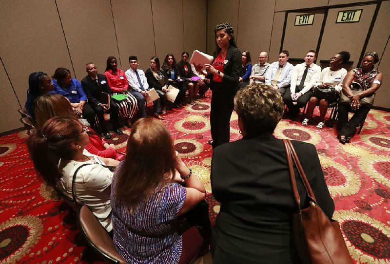 Recruitment coordinator Shamelly Pichardo (standing) gathers applicants at the Seminole Hard Rock Hotel & Casino Hollywood in June during a job fair in Hollywood, Fla. Employers slowed their hiring in July, adding 164,000 jobs, and the unemployment rate was unchanged. 