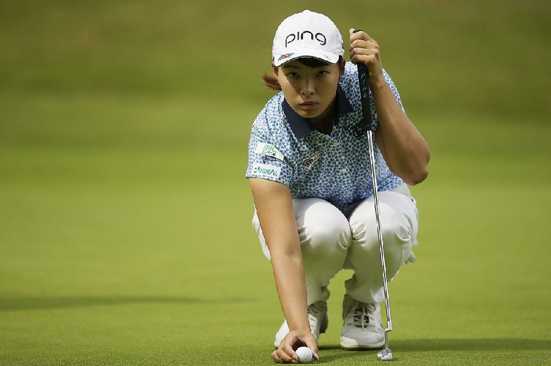 Japan's Hinako Shibuno prepares to put during the AIG Women's British Open golf championship at Woburn Gold Club near near Milton Keynes, England, Saturday, Aug. 3, 2019. 