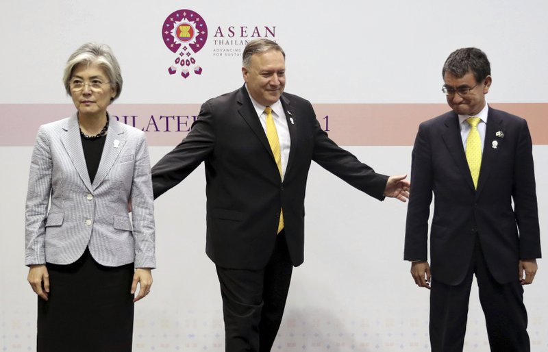 U.S. Secretary of State Mike Pompeo, center, gestures to his Japanese counterpart Taro Kono, right, and South Korean counterpart Kang Kyung-wha after a trilateral meeting on the sidelines of the ASEAN and dialogue partners foreign ministers' meeting in Bangkok, Thailand, Friday, Aug. 2, 2019. (Jonathan Ernst/Pool Photo via AP)