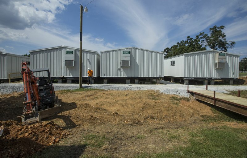 NWA Democrat-Gazette/BEN GOFF @NWABENGOFF A row of mobile classroom units stand Thursday, July 25, 2019, at Northside Elementary School in Rogers. The trailers will provide temporary classroom space as the school is renovated.