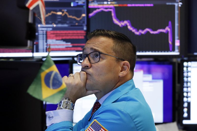 Specialist Paul Cosentino works on the floor of the New York Stock Exchange, Monday, Aug. 5, 2019. U.S. stocks nosedived in early trading on Wall Street Monday as China's currency fell sharply and stoked fears that the trade war between the world's two largest economies would continue escalating. (AP Photo/Richard Drew)

