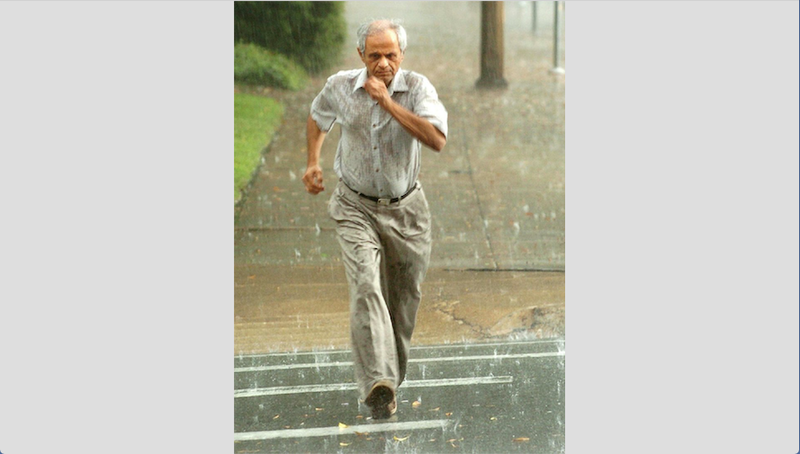 Imran Bohra runs for cover during a sudden thunderstorm in downtown Little Rock in this October 2010 feature photo.