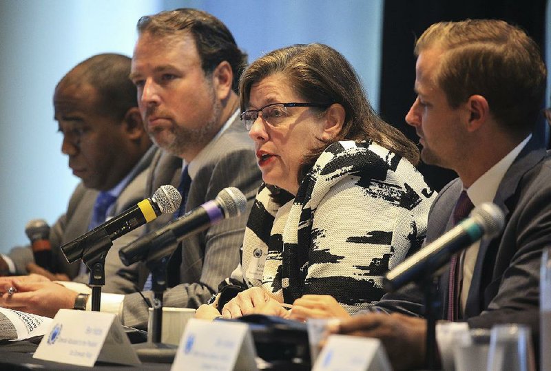 At an event on opportunity zones in Little Rock, Lisa Ferrell (third from left), developer of Rockwater Village in North Little Rock, speaks Monday along with panel members (from left) Jarrod Loadholt with Pine Street Strategies; Chris Caldwell, co-chairman of the Delta Regional Authority; and Ben Hobbs, special assistant to the president for domestic policy. 