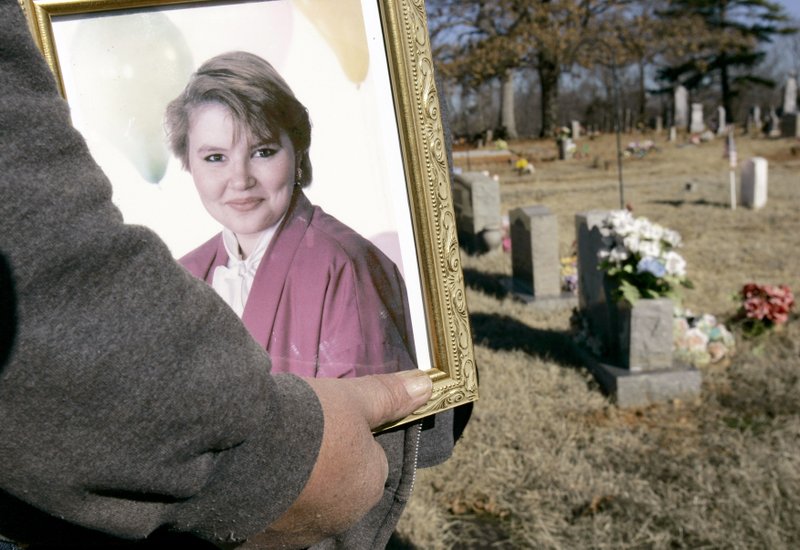 On Jan. 26, 2007, Ron Ward was interviewed near his daughter's grave at Canaan Cemetery near Marshall. Olivia Jane "Janie" Ward died during a teen cabin party in September 1989, leaving her parents questioning the circumstances and feeling forgotten by what they saw as a ragtag investigation of her death. The case is the subject of Hell and Gone, a Katherine Townsend investigative podcast from iHeartRadio. It began July 24 and continues for seven more Wednesdays. (Photo by Danny Johnston via AP) 