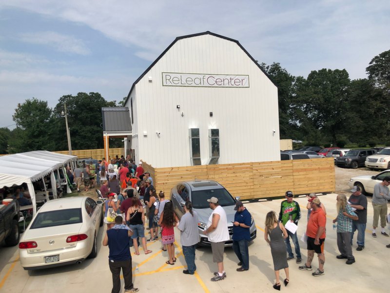 Customers line up waiting for the doors to open at The ReLeaf Center at 9400 E. McNelly Road in Bentonville